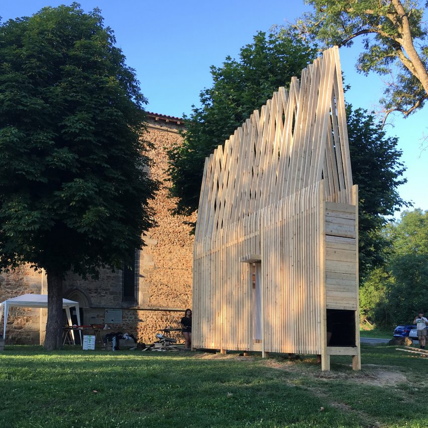 A triangular shaped wooden hut