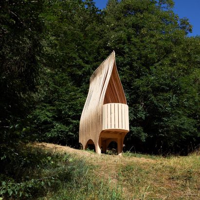 A wooden hut exhibited at The Cabins Festival