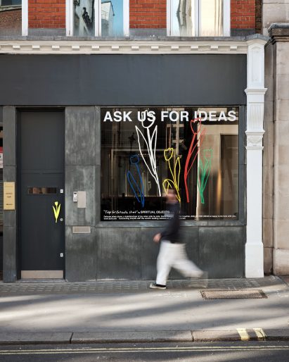 Exterior of office space in New Cross, London with roughly textured walls and black cladding