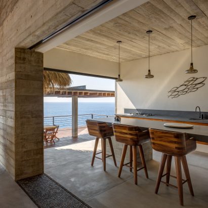Semi-open dining area on the top level with kitchen and bar