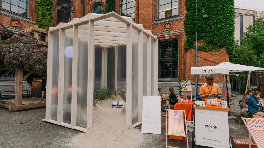 Greenhouse-like pavilion encloses Danish sand and plants to create “dynamic ecosystem”