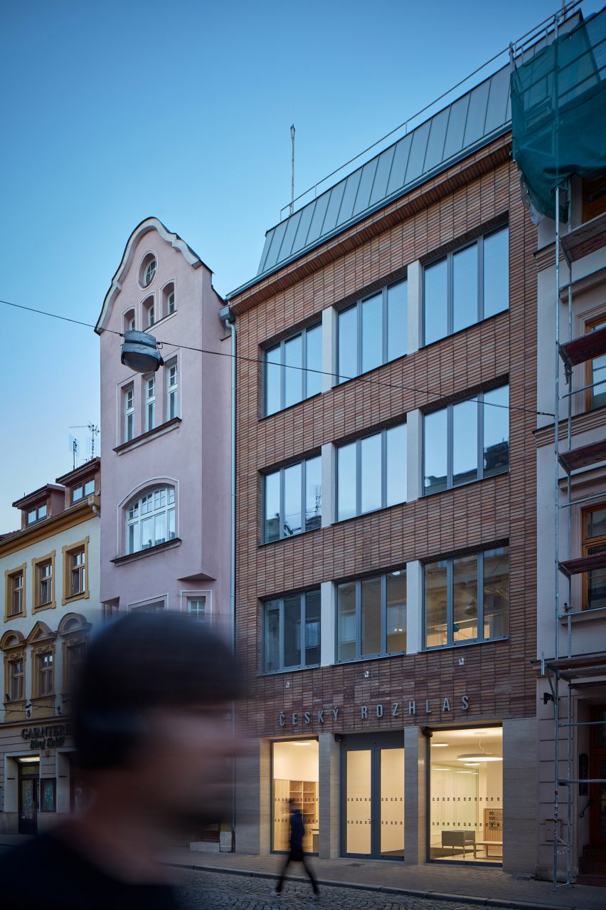 Photograph showing narrow facade of building onto street