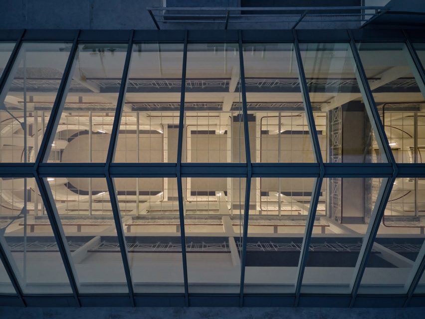 Photograph showing aerial view of building with glowing lantern rooflight