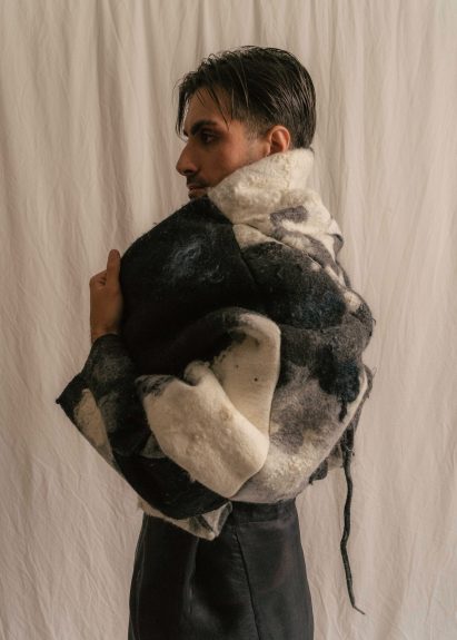 Model wearing a cream and black felt cropped jacket by a Design Institute of Australia student