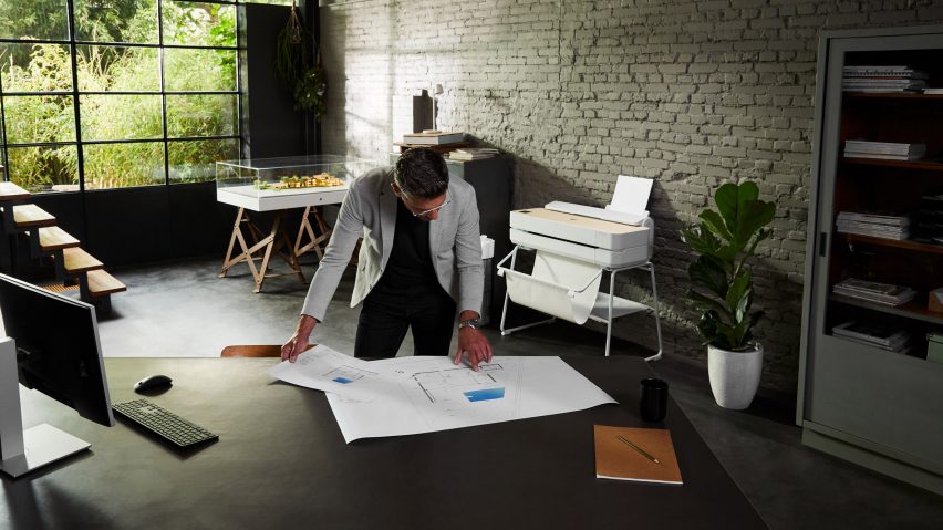 Designer looking at technical printout