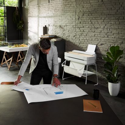 Designer looking at technical printout
