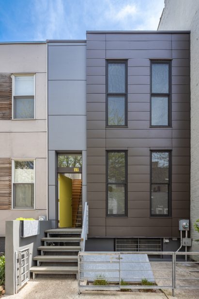 Renovated Brooklyn townhouse exterior with steps leading to entrance