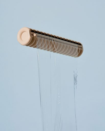 A beige cling film dispenser and transparent film