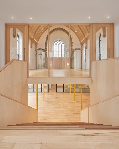 Photograph showing entrance area, stairs to ground floor and main hall access area