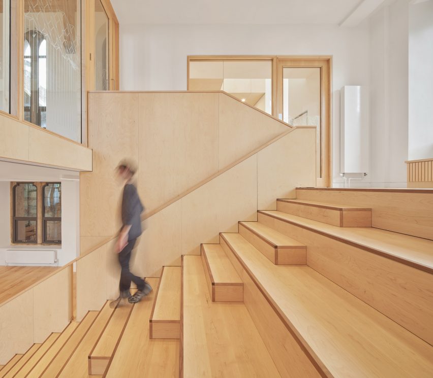 Photograph showing someone walking down stairway