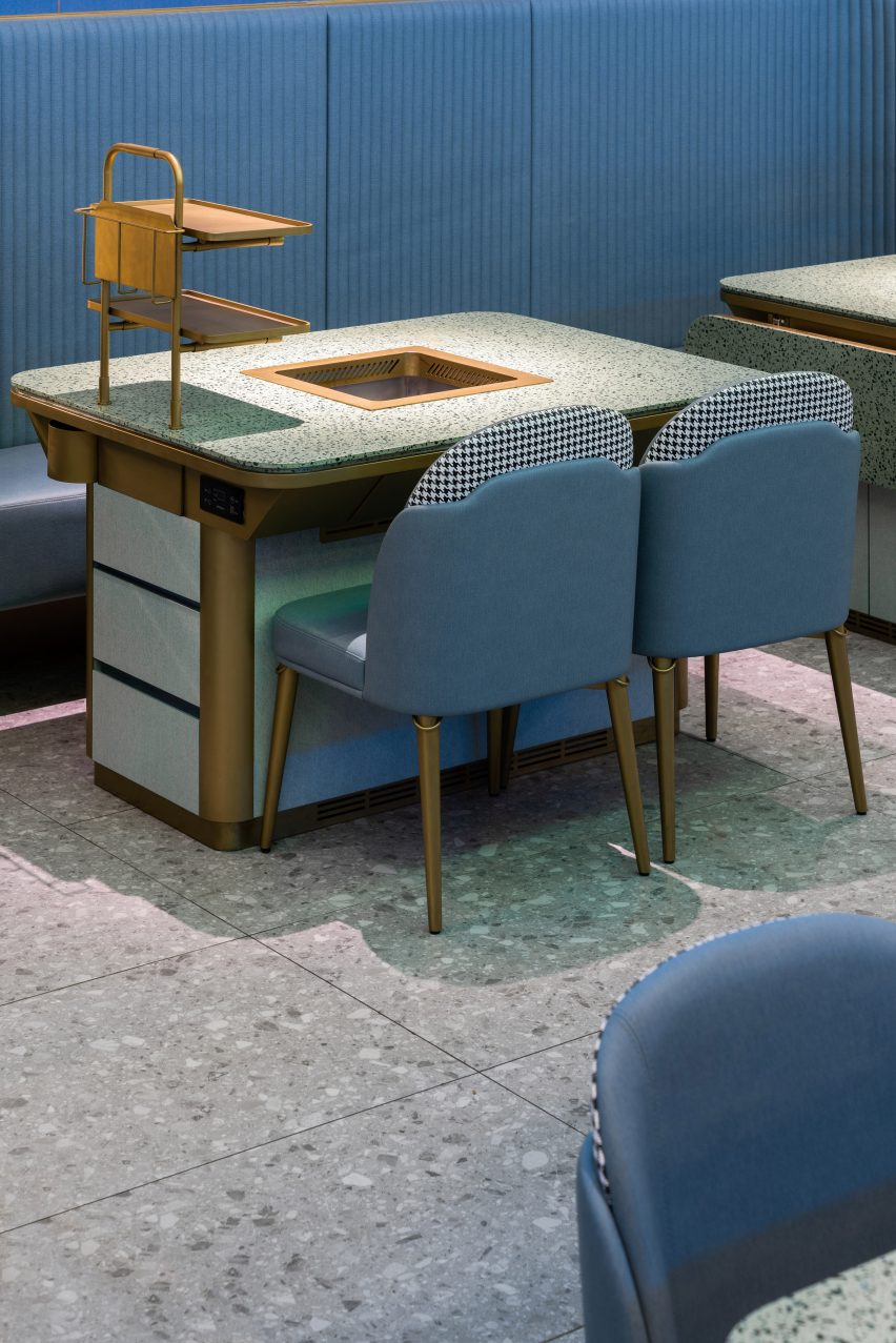 Shenzhen's Haidilao restaurant by Vermilion Zhou Design Group features blue-green interiors
