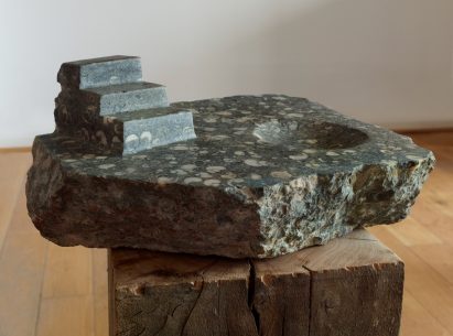 Marble sculpture in flecked stone