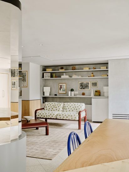 Clover-patterned sofa in lounge area of hotel lobby by Marion Mailaender
