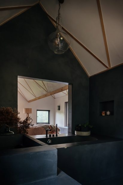 Black bathroom with tub 
