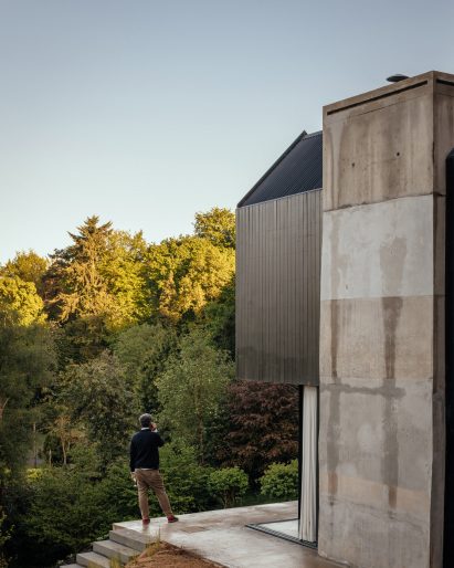 Exterior of concrete and timber house by Invisible Studio