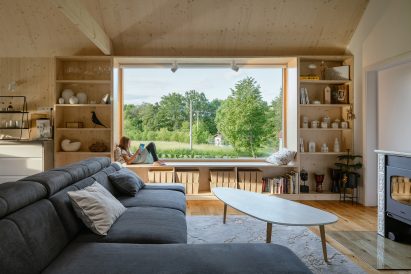 Open-plan living room of House with In-Law Suite by KLAR