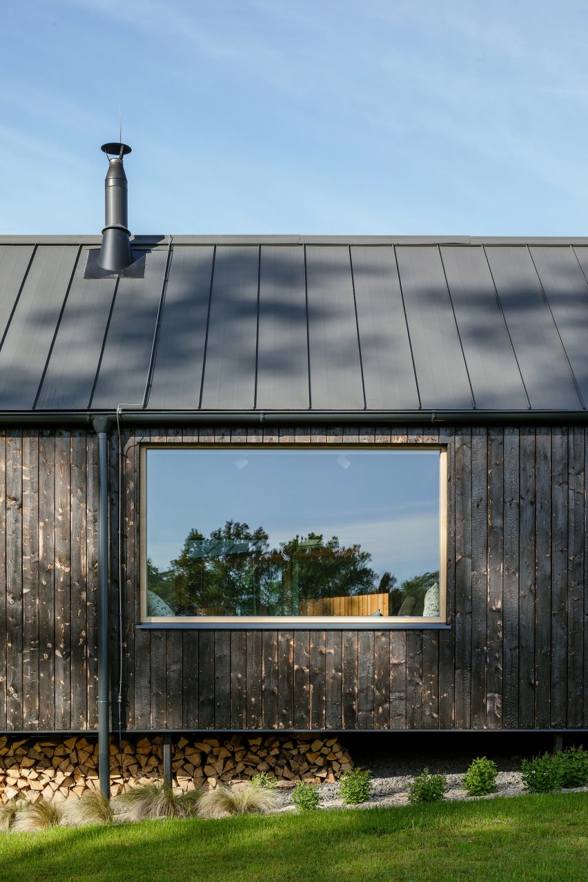 Exterior of House with In-Law Suite by KLAR