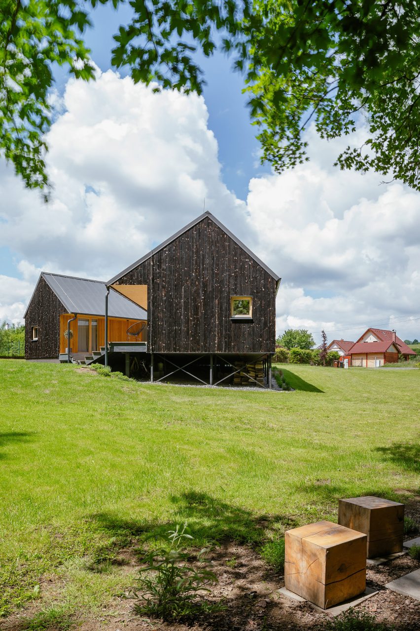 Exterior of House with In-Law Suite by KLAR