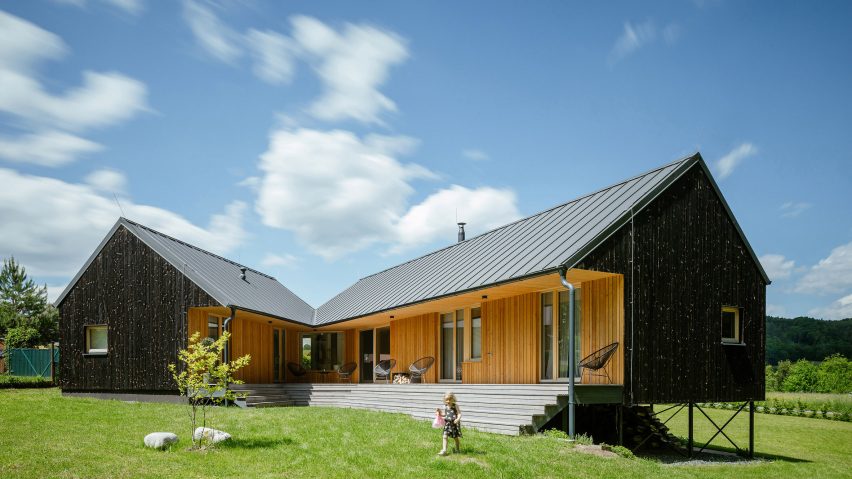 Child beside terrace of House with In-Law Suite by KLAR