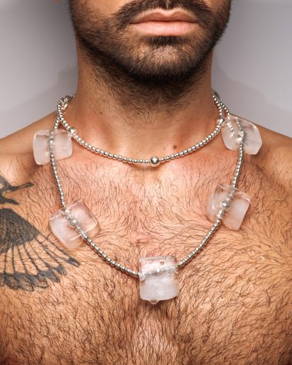 Man modelling oOoooOoooOh la l'ice with silver beads of varying sizes