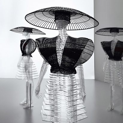 Image of transparent mannequins wearing Issey Miyake