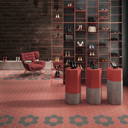 Red hexagon Kerastar tiles on the floor of a shoe shop