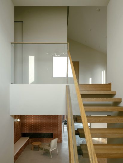 Wooden staircase inside Anna Garden House by Kiki Archi