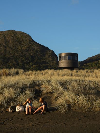Children sat close to Te Pae lifeguard tower in New Zealand
