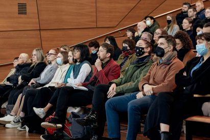 A group of people listening to the talks
