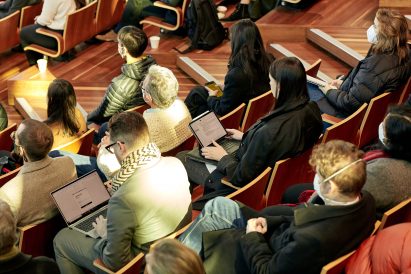 People on their laptops taking notes