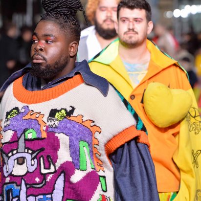 Models in bright clothing walking the Central Saint Martins fashion catwalk