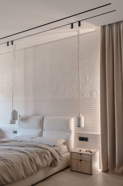 All-beige Bedroom of house in Kozyn, Ukraine, by Makhno Studio with tall ceilings and pendant lights next to the bed