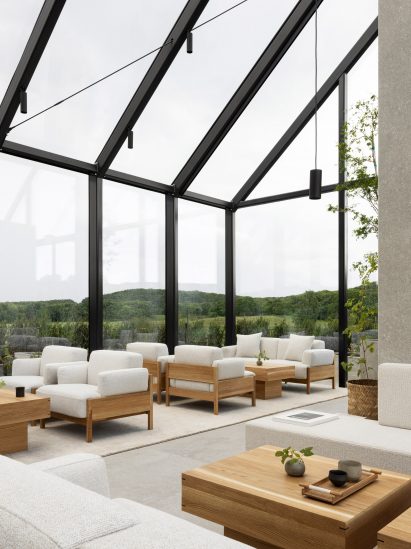 Greenhouse-like restaurant in Sweden with oak sofas and tables