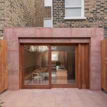 Exterior image of the red stone extension at Kensington Place