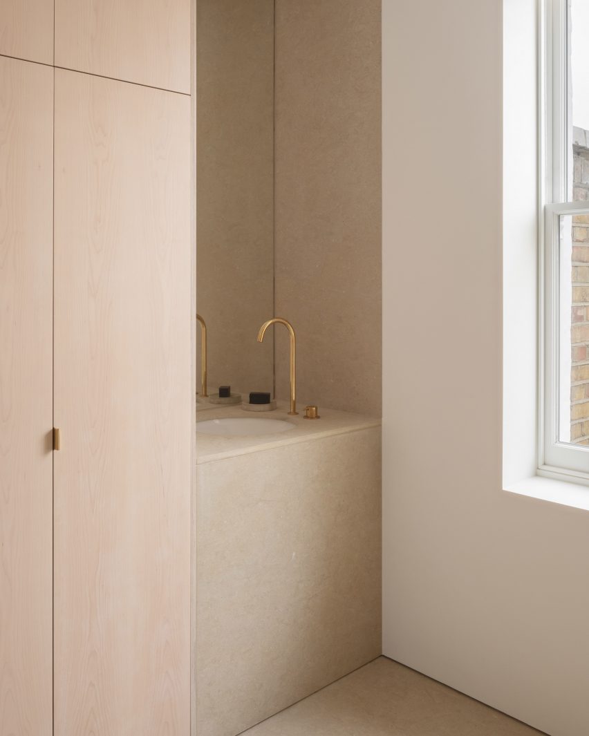 Red stone covers extension to London terrace by O’Sullivan Skoufoglou Architects