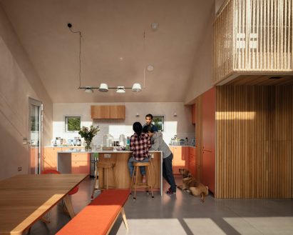 Open-plan kitchen, living, and dining space by Pad Studio