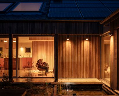 Night view of Clay Retreat in Hampshire by Pad Studio