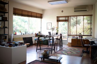 Sunny studio in Beirut with colourful carpets and pale walls