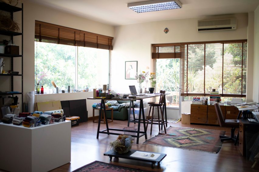 Sunny studio in Beirut with colourful carpets and pale walls