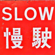A red road sign saying Stop