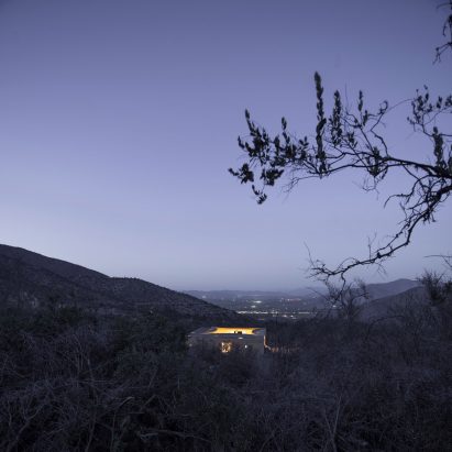 Night view of Raem House by Pezo von Ellrichshausen from a distance