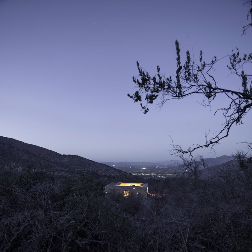 Night view of Raem House by Pezo von Ellrichshausen from a distance