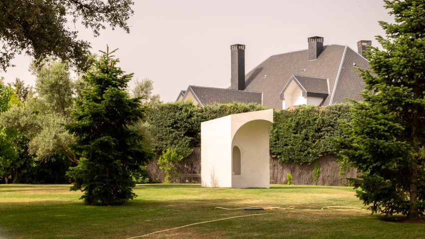 Image of concrete memorial pictured through trees
