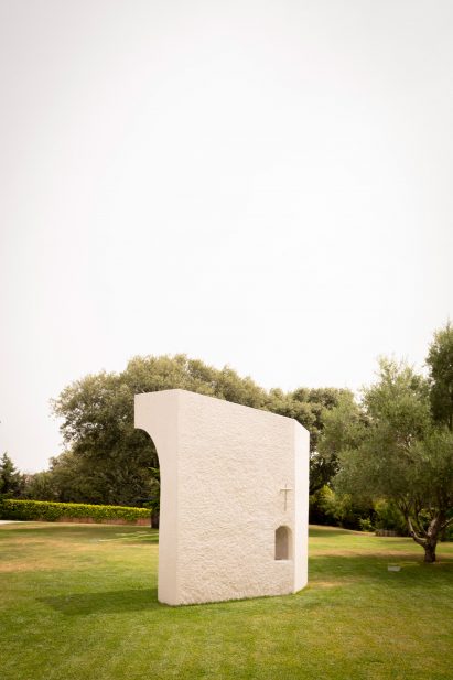 Bush-hammered facade of La Ermita de Lola