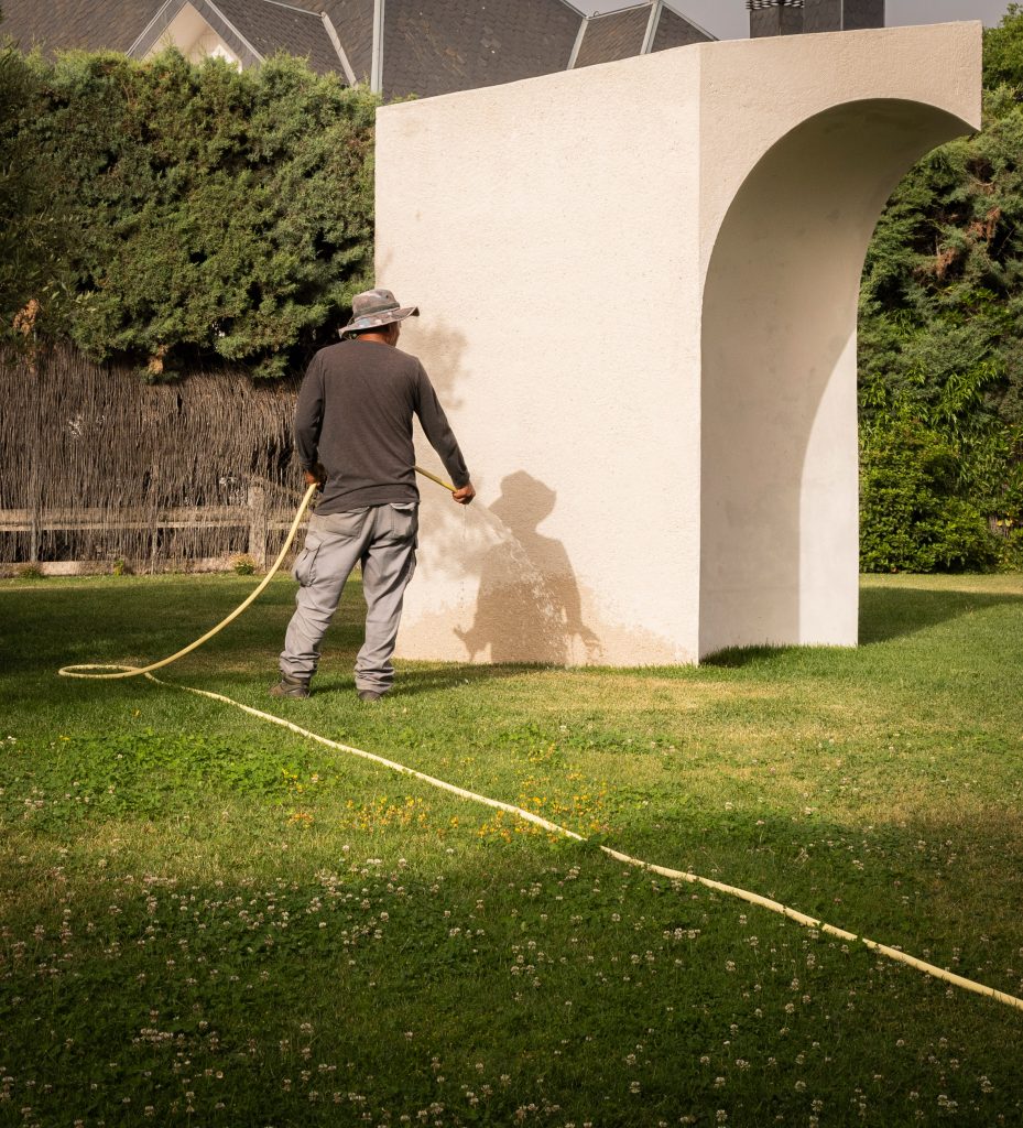 Person beside La Ermita de Lola memorial in Spain by Ramos Alderete