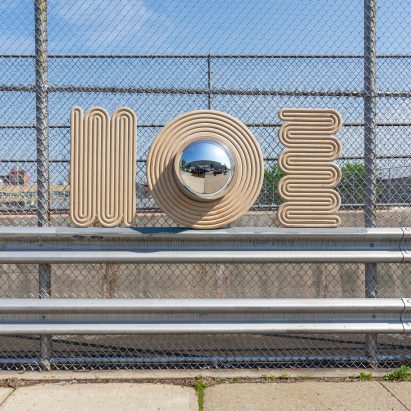 Photograph showing mirror and wall decor in urban car park