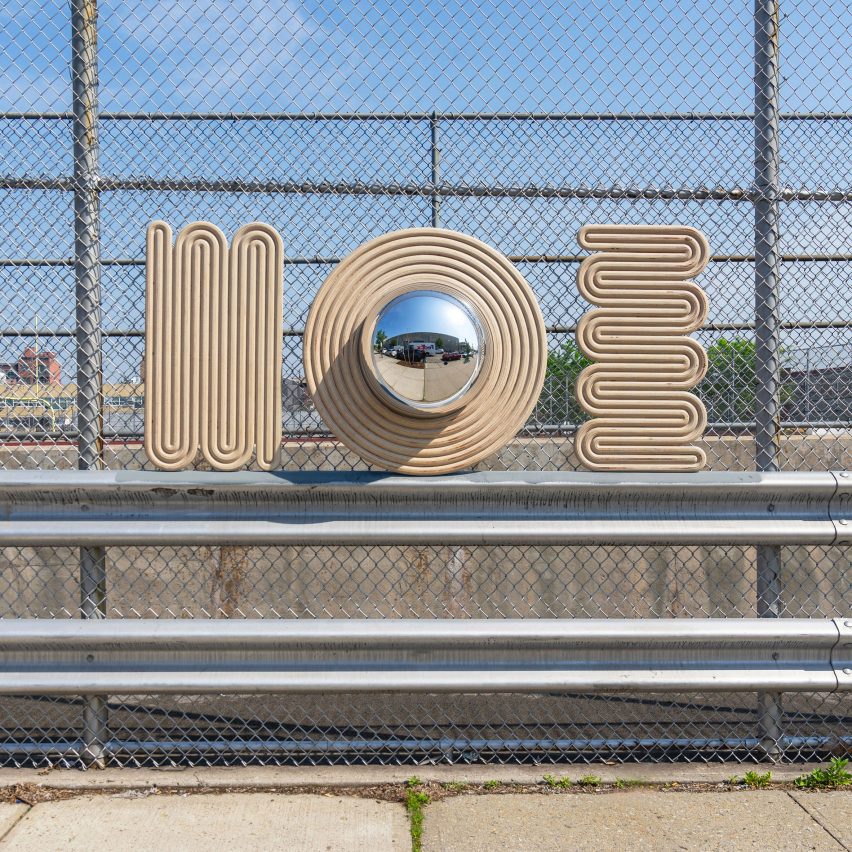 Photograph showing mirror and wall decor in urban car park