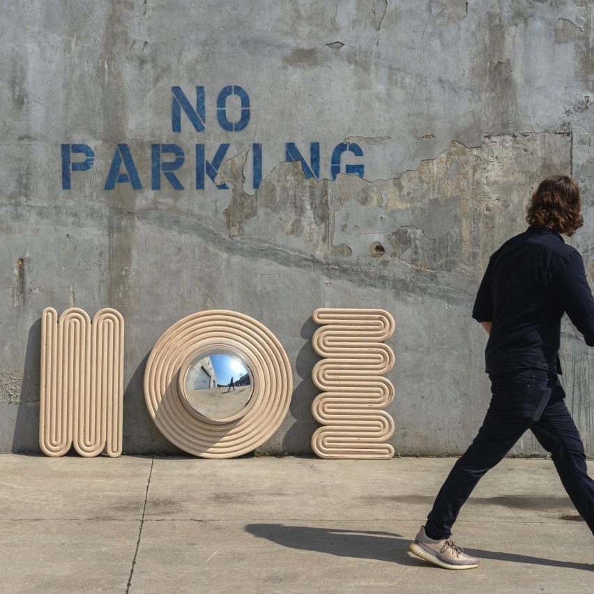 Photograph showing mirror and wall decor in urban car park
