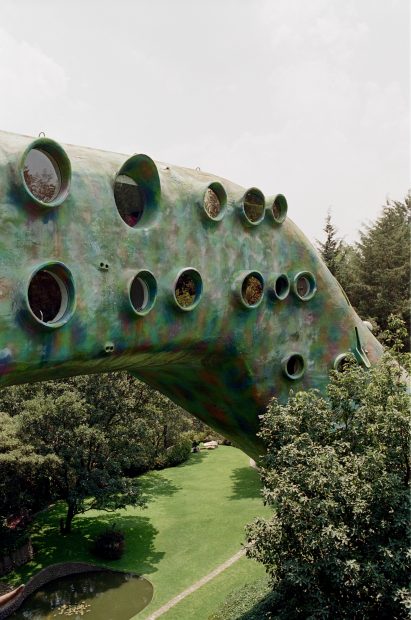 Circular windows in the body of the snake-shaped building