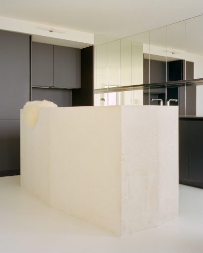 Interior image of the kitchen with a stone island at the Paris apartment